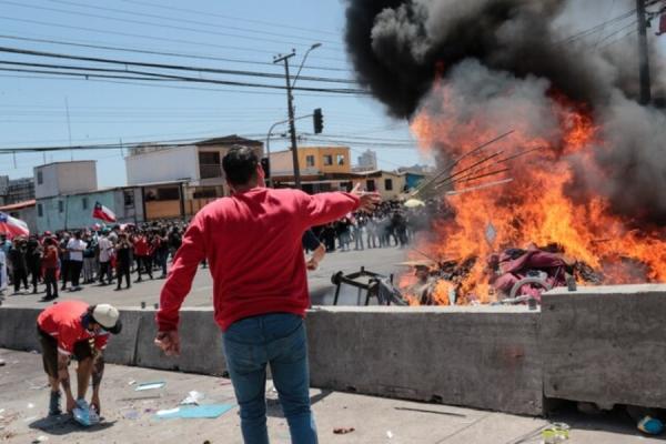 Investigan quema de pertenencias  de migrantes venezolanos en Chile