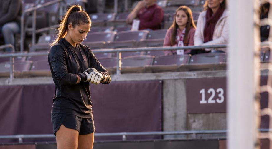 Focused Goalkeeper Beneath Stadium Lights